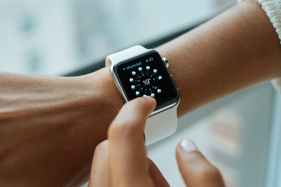 Smartwatch on a wrist, illustrating how wearable alerts can prompt medical follow-up for possible atrial fibrillation