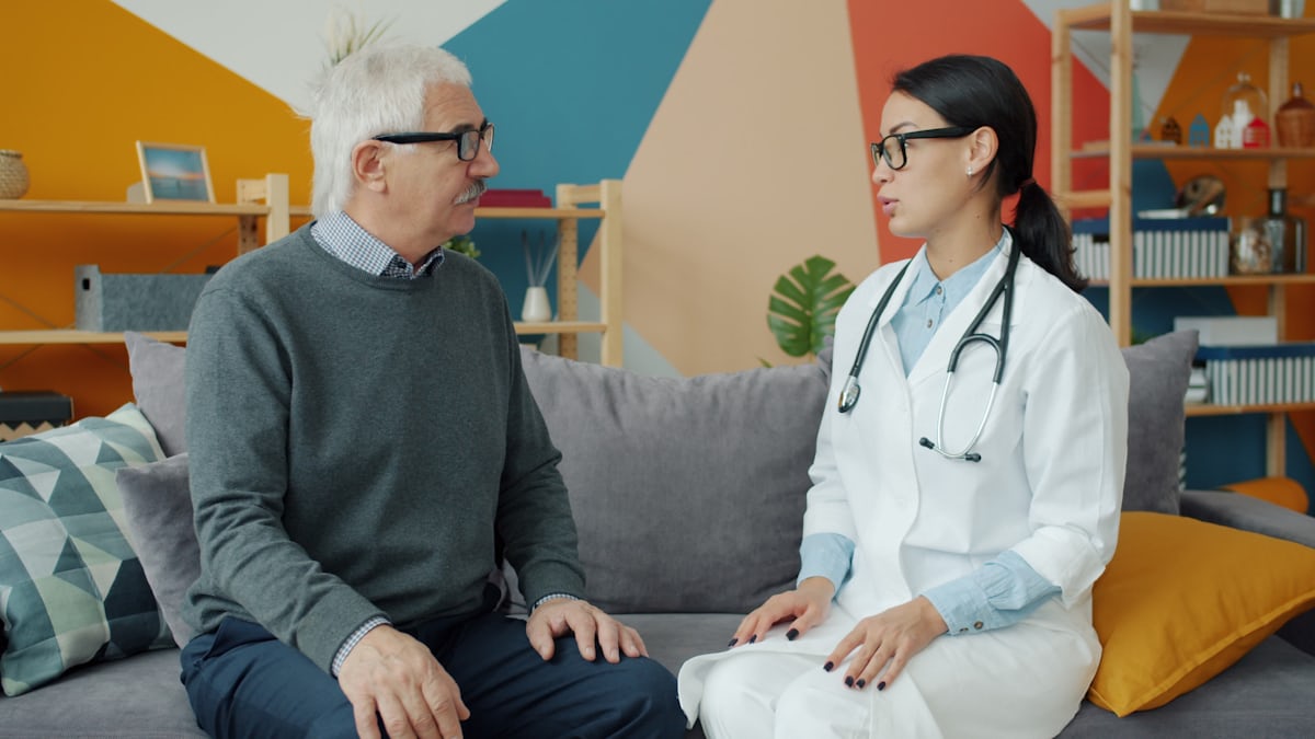 Doctor speaking with an older patient about preventive heart care