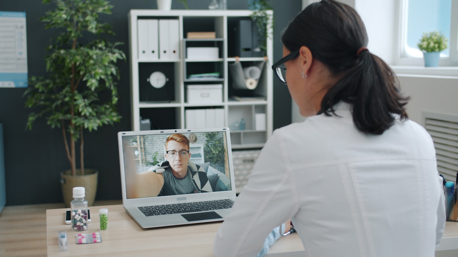 Virtual cardiology consultation on a laptop screen