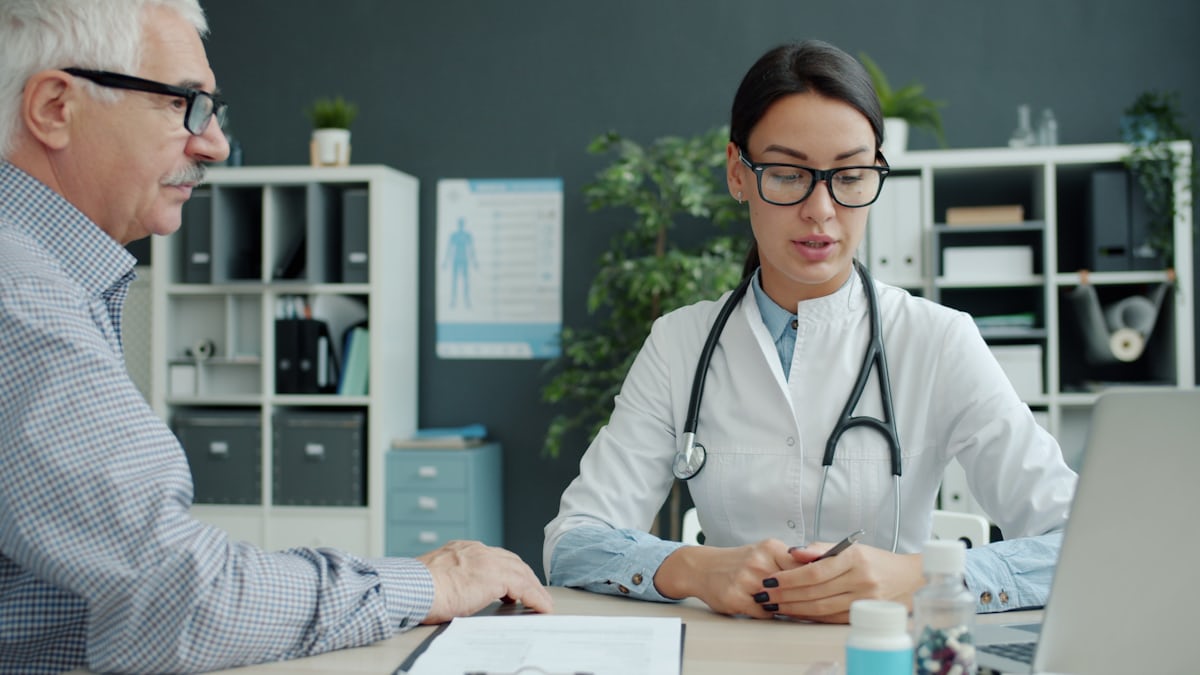 Doctor reviewing a heart-related consultation with a patient